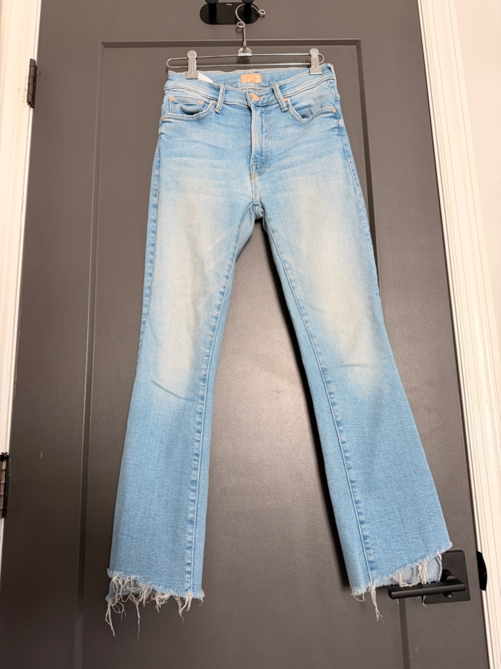 MOTHER Light Wash High-Rise Jeans with Pink Accents the insider crop step fray